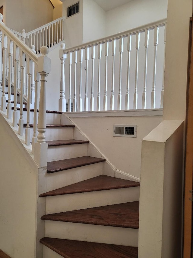 staircase featuring visible vents