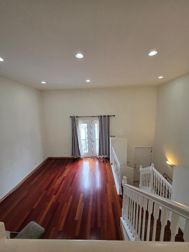 unfurnished bedroom with baseboards, dark wood-type flooring, and recessed lighting