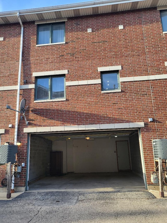 exterior space with driveway and an attached garage