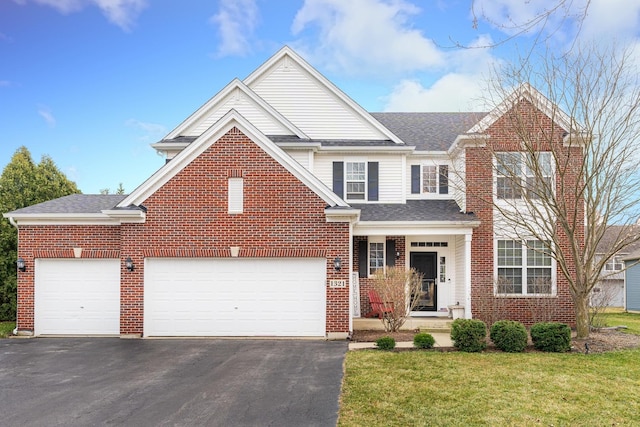 traditional home with brick siding, roof with shingles, a garage, driveway, and a front lawn