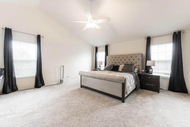 bedroom featuring a ceiling fan, light carpet, and multiple windows