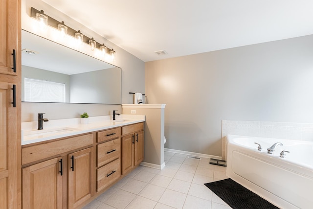 full bath featuring double vanity, tile patterned floors, visible vents, a sink, and a bath