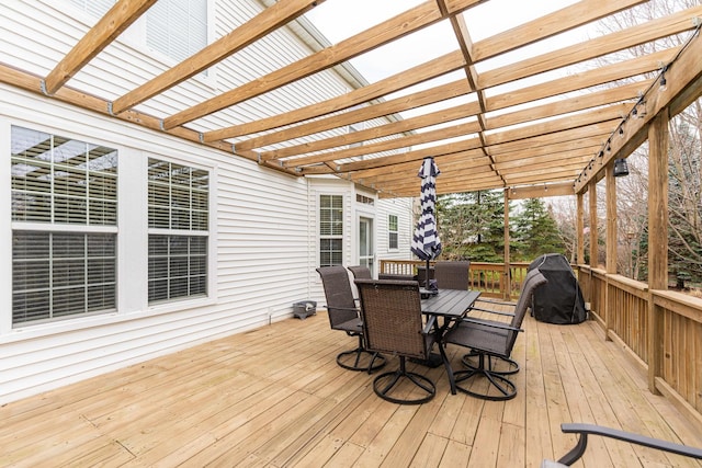 deck with a pergola and outdoor dining space