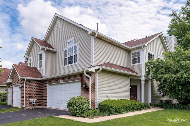 2018 Fulham Dr Unit 2018, Naperville, IL 60564 - view of home's exterior with driveway, an attached garage, and brick siding