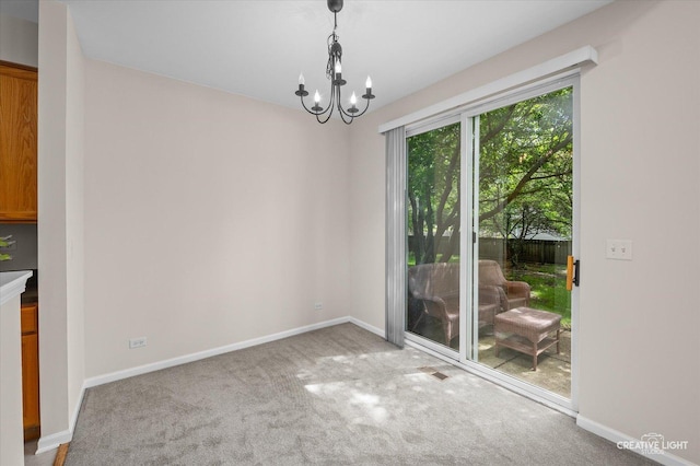 2018 Fulham Dr Unit 2018, Naperville, IL 60564 - dining area featuring carpet flooring, a chandelier, and baseboards