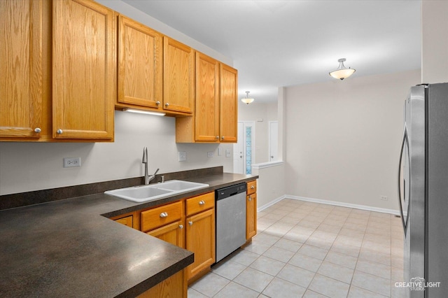 2018 Fulham Dr Unit 2018, Naperville, IL 60564 - kitchen featuring stainless steel appliances, a sink, dark countertops, light tile patterned floors, and baseboards