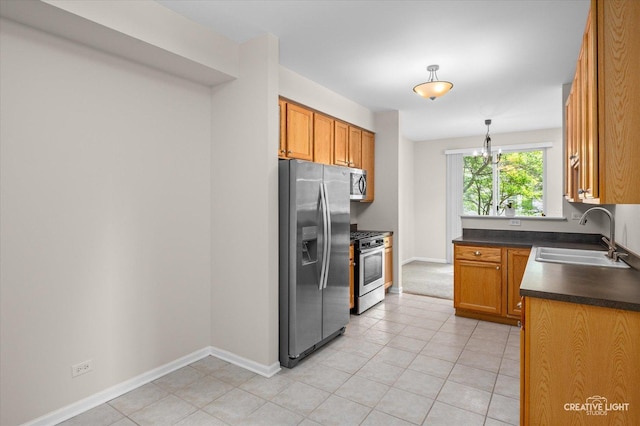 2018 Fulham Dr Unit 2018, Naperville, IL 60564 - kitchen with stainless steel appliances, a sink, dark countertops, baseboards, and light tile patterned flooring