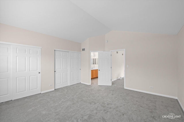 2018 Fulham Dr Unit 2018, Naperville, IL 60564 - unfurnished bedroom with vaulted ceiling, two closets, carpet flooring, and baseboards