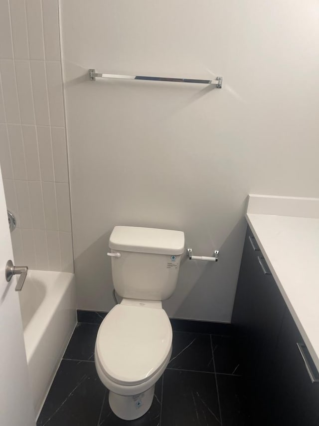 full bath with vanity, toilet, and tile patterned floors