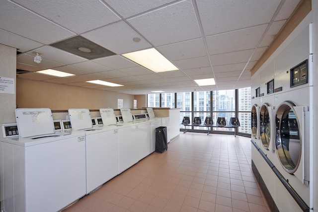 common laundry area with independent washer and dryer