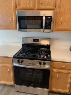 kitchen featuring light countertops and appliances with stainless steel finishes