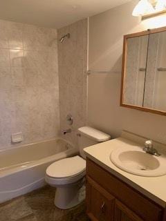 full bathroom with shower / washtub combination, vanity, and toilet