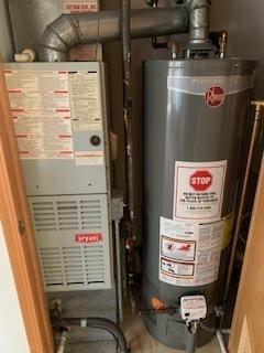 utilities with gas water heater and heating unit