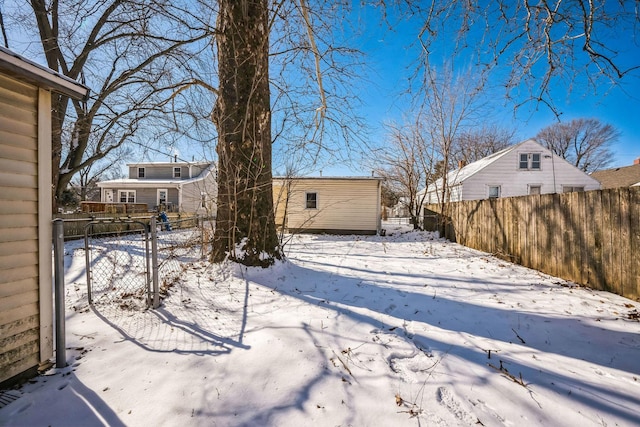 snowy yard with fence