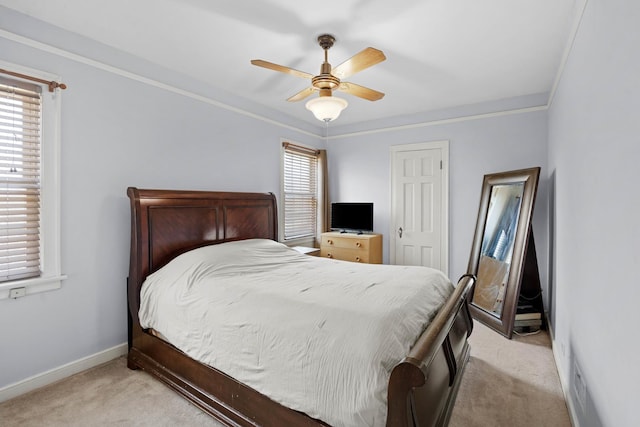 bedroom with light carpet, multiple windows, crown molding, and baseboards