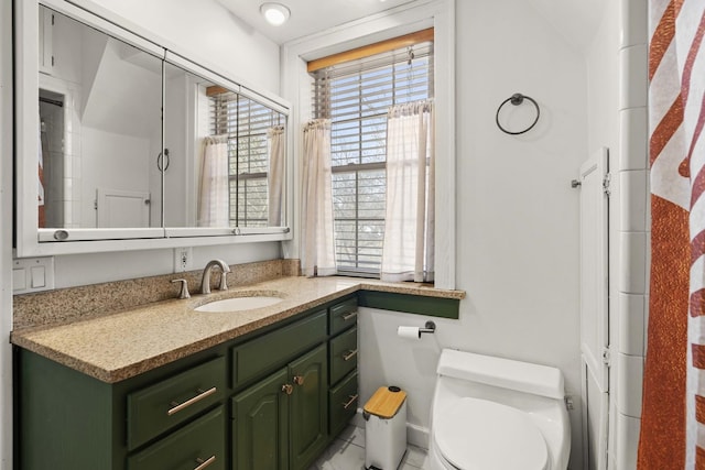 bathroom featuring vanity and toilet