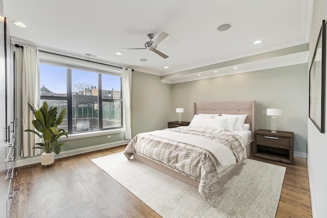 bedroom with visible vents, baseboards, ornamental molding, recessed lighting, and wood finished floors