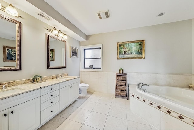 full bathroom with tile patterned flooring, visible vents, tile walls, and a sink