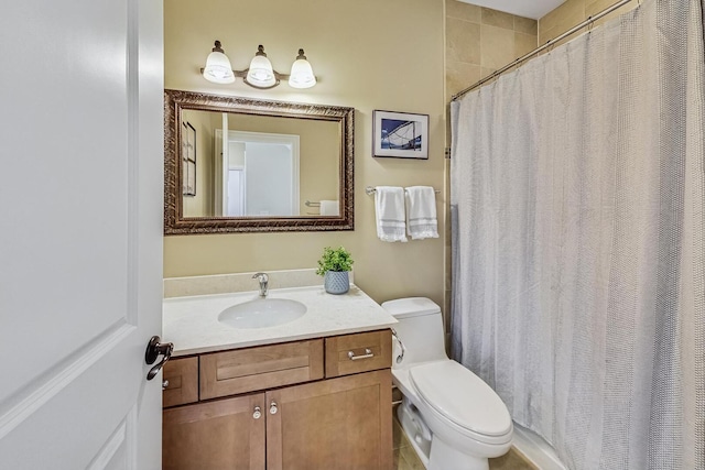 bathroom featuring curtained shower, toilet, and vanity