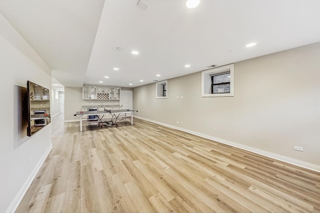 interior space with visible vents, recessed lighting, baseboards, and light wood finished floors