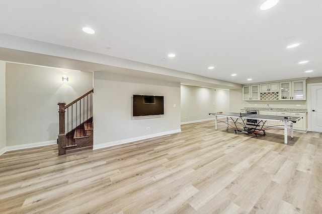 interior space featuring recessed lighting, baseboards, and light wood-type flooring