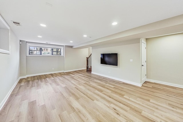 basement featuring visible vents, light wood-style flooring, recessed lighting, stairway, and baseboards