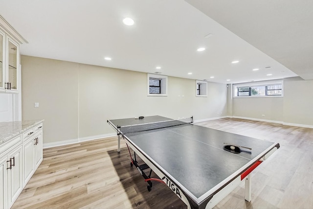 game room with recessed lighting, baseboards, and light wood-style floors