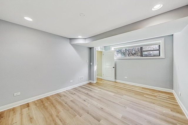 basement featuring recessed lighting, visible vents, baseboards, and light wood-style flooring