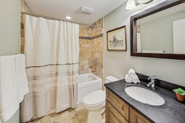 bathroom with vanity, toilet, and shower / bath combo with shower curtain