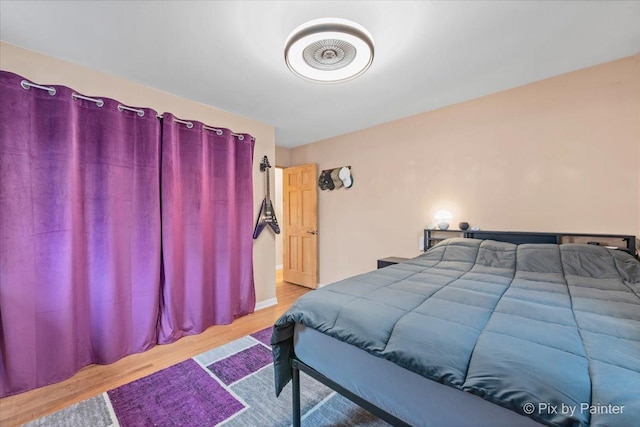 bedroom featuring wood finished floors