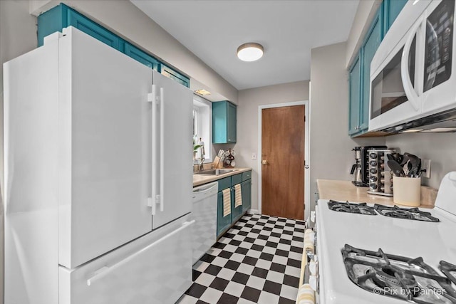 kitchen featuring light countertops, white appliances, tile patterned floors, and blue cabinets