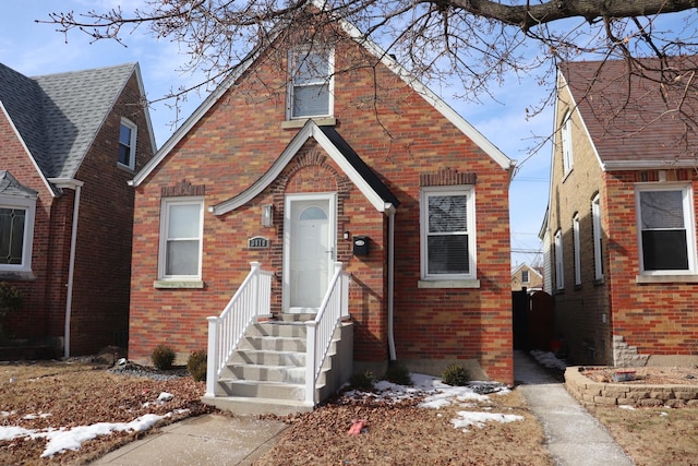 view of front of property featuring brick siding