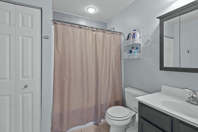 full bath featuring shower / bath combo, vanity, toilet, and tile patterned floors