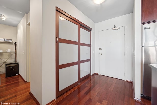 hall featuring dark wood-style flooring