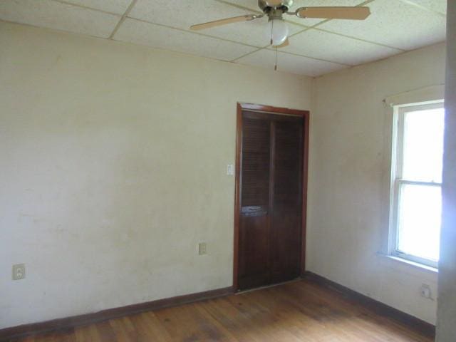 525 Price Ave, Calumet City, IL 60409 - unfurnished room featuring plenty of natural light, a ceiling fan, wood finished floors, and a paneled ceiling