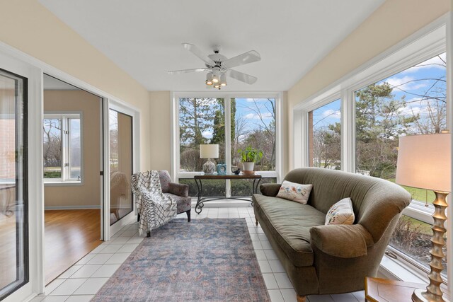 sunroom with tile patterned floors and healthy amount of natural light