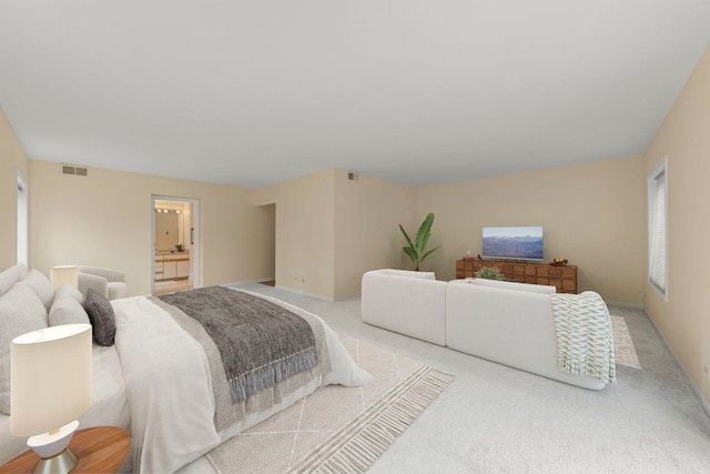 bedroom featuring carpet floors and connected bathroom