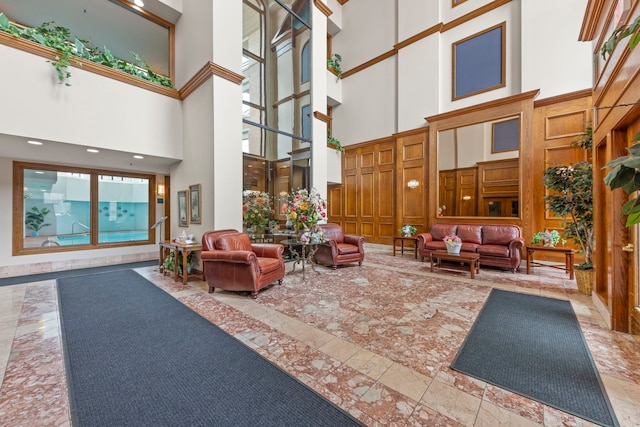 community lobby with a high ceiling and recessed lighting