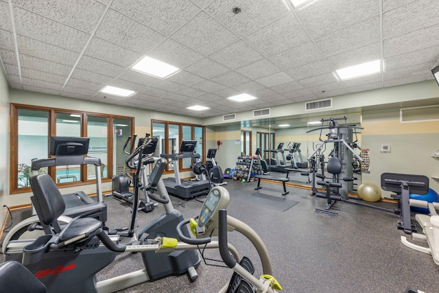 gym featuring a drop ceiling