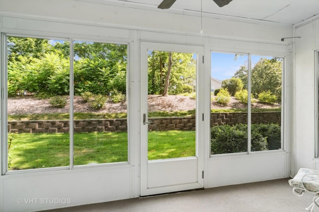 doorway with a ceiling fan