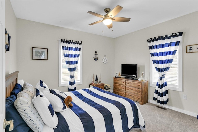 bedroom with baseboards, ceiling fan, and carpet flooring