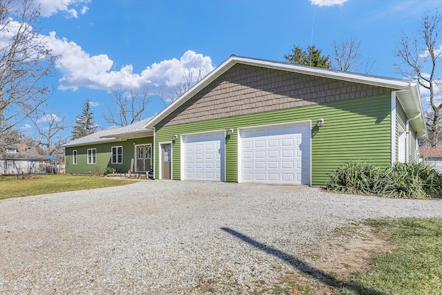 exterior space with gravel driveway