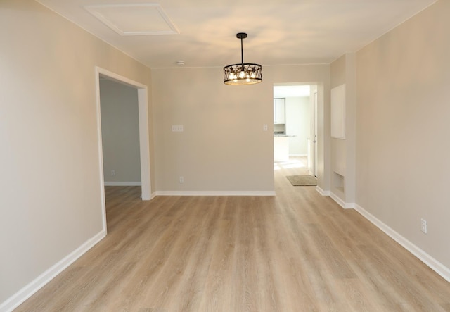 unfurnished room featuring light wood-style floors and baseboards