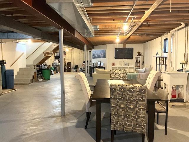 unfinished basement featuring stairway