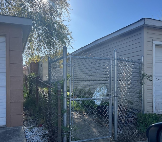 view of gate featuring fence