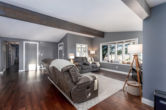 living room with lofted ceiling with beams, dark wood-style floors, and baseboards
