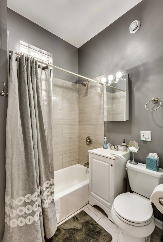 bathroom featuring toilet, shower / tub combo, tile patterned flooring, and vanity