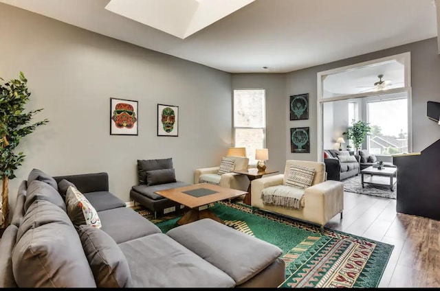 living area with a wealth of natural light and wood finished floors