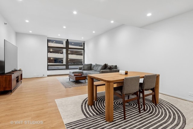 dining room featuring light wood-style flooring and recessed lighting