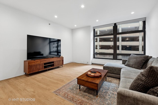 living room featuring wood finished floors and recessed lighting